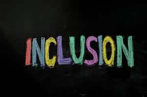 inclusion written on chalkboard