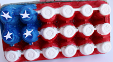 An 18-count egg carton painted with the colors of the American flag