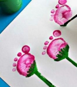 Art project with flowers made from a baby's footprint in paint