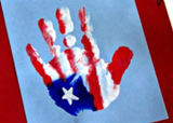A child's handprint painted like the American flag