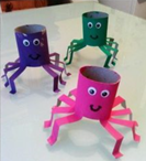 Three octopuses made out of paper towel rolls