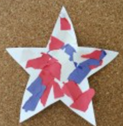 A white construction paper star decorated with red and blue tissue paper