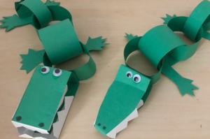 Two alligators made from green construction paper