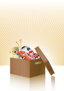 A cardboard box filled with toys