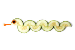 A snack made out of cucumbers and shaped like a snake